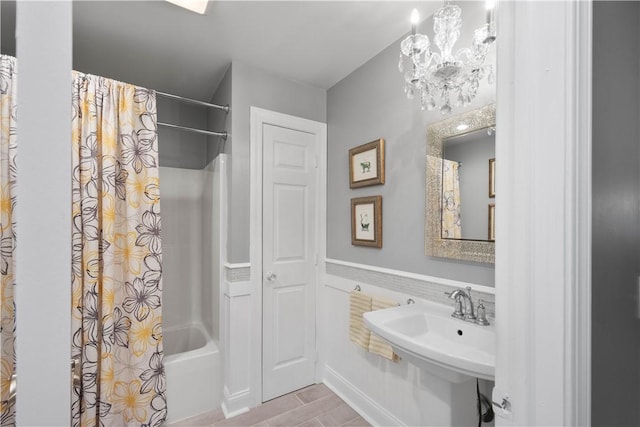 102 Klages Rd, Donegal, PA 15376 - full bathroom with shower / bath combo, a chandelier, and wood finished floors