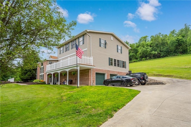 102 Klages Rd, Donegal, PA 15376 - view of side of home featuring a lawn, driveway, an attached garage, and brick siding
