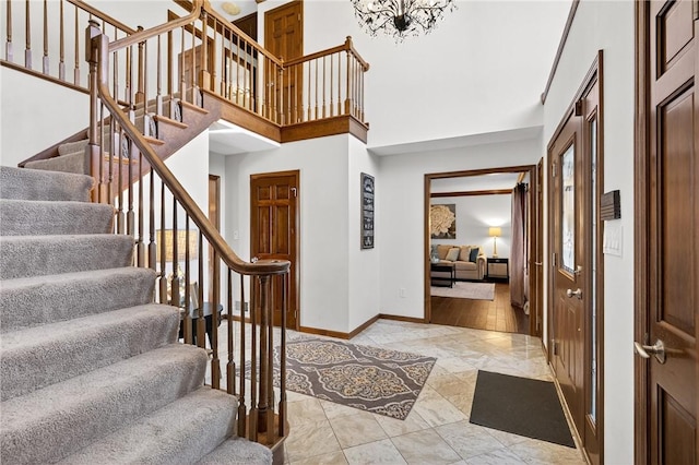 2455 Dogwood Dr, Franklin Park, PA 15090 - entryway with stairway, light marble finish flooring, and a towering ceiling