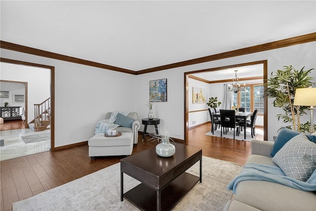 2455 Dogwood Dr, Franklin Park, PA 15090 - living room with a chandelier, wood finished floors, and crown molding