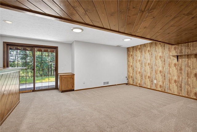 2455 Dogwood Dr, Franklin Park, PA 15090 - empty room with wooden walls, wooden ceiling, light colored carpet, and recessed lighting