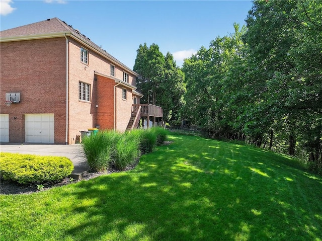 2455 Dogwood Dr, Franklin Park, PA 15090 - view of green lawn featuring stairway, a garage, and a deck