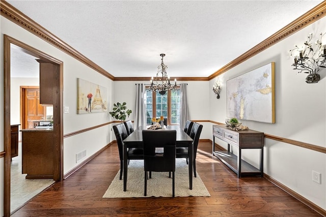 2455 Dogwood Dr, Franklin Park, PA 15090 - dining space with a chandelier, dark wood-style floors, a textured ceiling, and ornamental molding