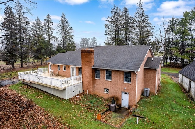 1664 N Main St, Center Twp, PA 16001 - rear view of property featuring a yard, a deck, brick siding, a chimney, and roof with shingles