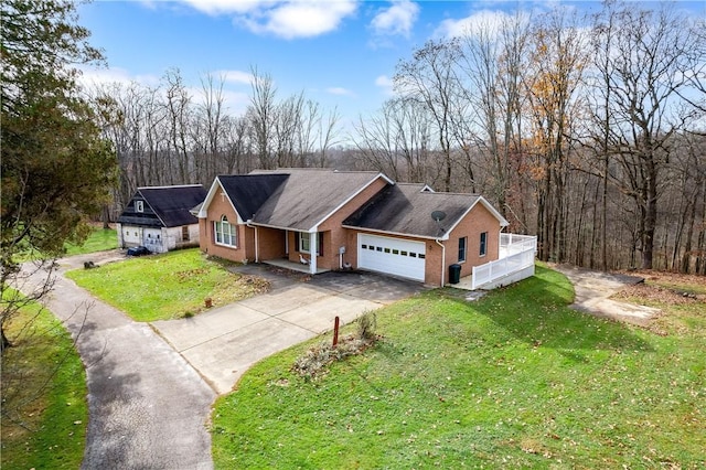 1664 N Main St, Center Twp, PA 16001 - view of front of property featuring a garage, a front lawn, asphalt driveway, a porch, and brick siding