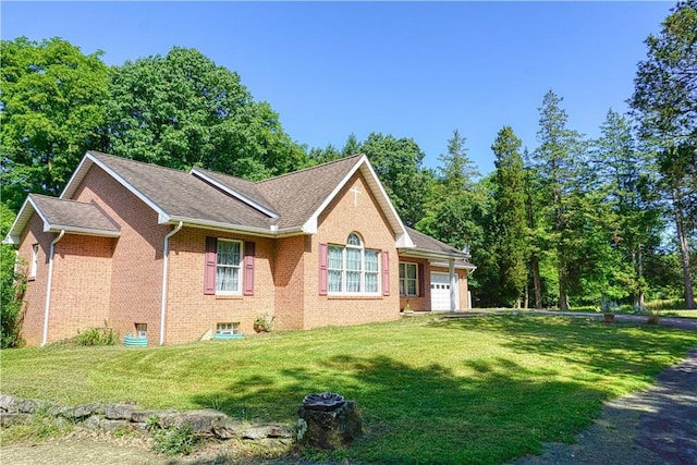 1664 N Main St, Center Twp, PA 16001 - view of front of house featuring an attached garage, a front lawn, brick siding, and roof with shingles