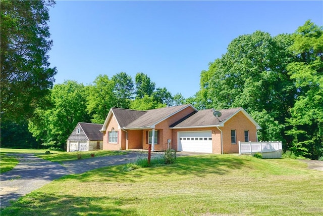 1664 N Main St, Center Twp, PA 16001 - single story home featuring asphalt driveway, a front yard, and a garage