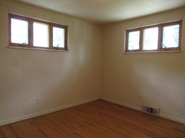 438 Saratoga Dr, Pleasant Hills, PA 15236 - empty room with wood finished floors and plenty of natural light