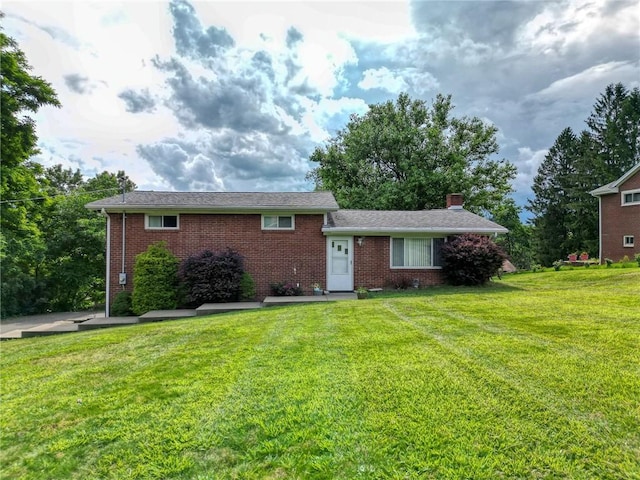 223 Larue Dr, Moon/Crescent Twp, PA 15108 - view of front of property with brick siding, a front lawn, and a chimney