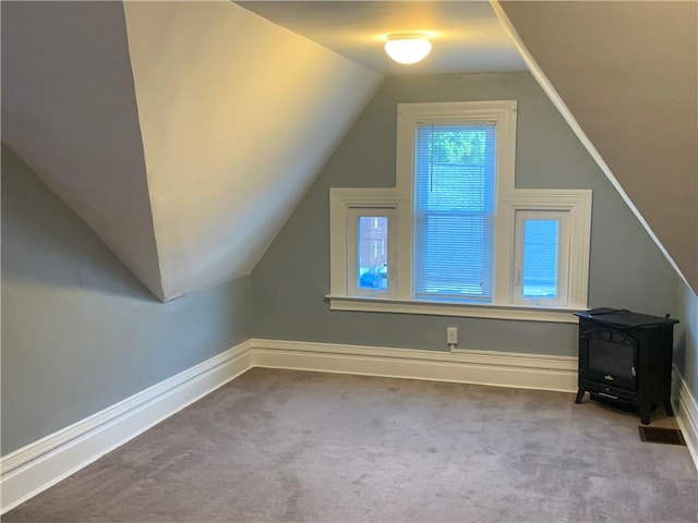 74 Wilson St, Etna, PA 15223 - bonus room featuring a wood stove, carpet flooring, and lofted ceiling