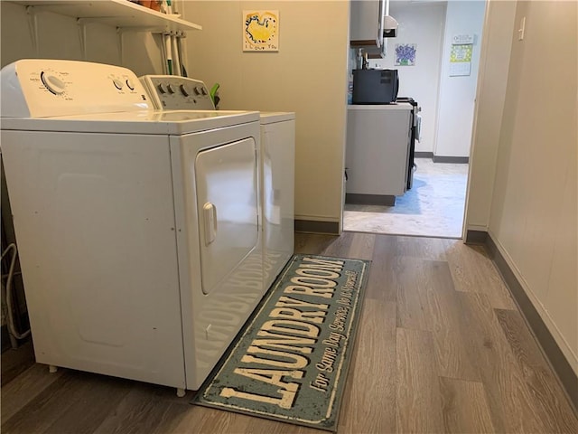 74 Wilson St, Etna, PA 15223 - washroom with washer and dryer and wood finished floors