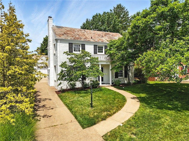 590 Kenilworth Dr, Mt Lebanon, PA 15228 - view of front of home featuring a chimney, a front lawn, and brick siding