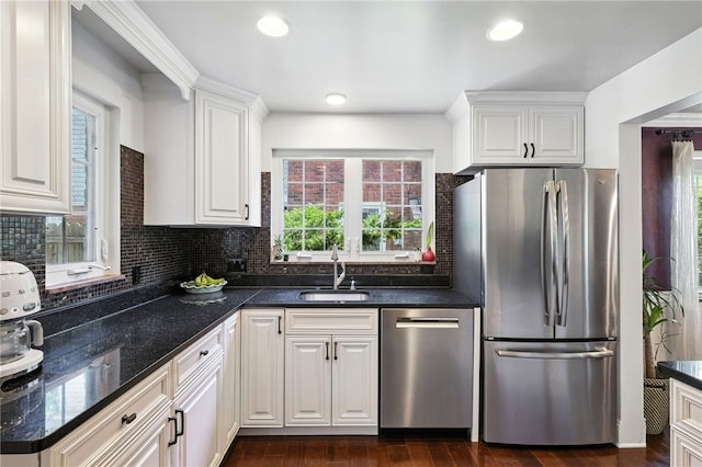 590 Kenilworth Dr, Mt Lebanon, PA 15228 - kitchen featuring stainless steel appliances, white cabinetry, decorative backsplash, dark wood-type flooring, and dark stone counters