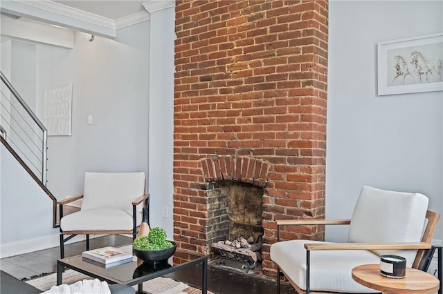 4228 Post St, Lawrenceville, PA 15201 - sitting room with stairs, ornamental molding, wood finished floors, and a brick fireplace
