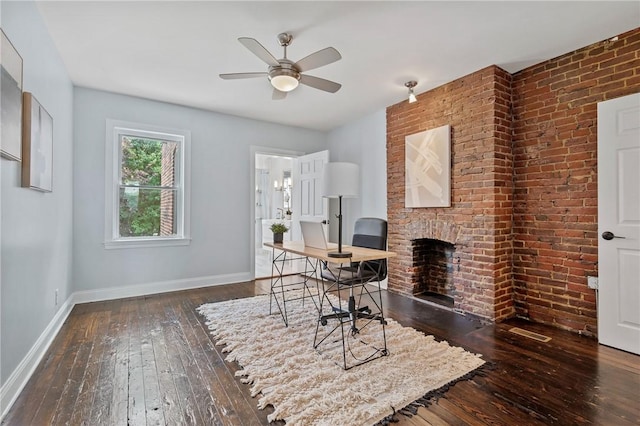 4228 Post St, Lawrenceville, PA 15201 - home office featuring wood-type flooring, a ceiling fan, and a brick fireplace