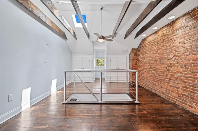 4228 Post St, Lawrenceville, PA 15201 - hallway featuring wood-type flooring, brick wall, and an upstairs landing