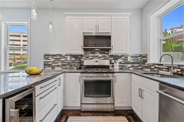 4228 Post St, Lawrenceville, PA 15201 - kitchen with stainless steel appliances, wine cooler, plenty of natural light, and white cabinets