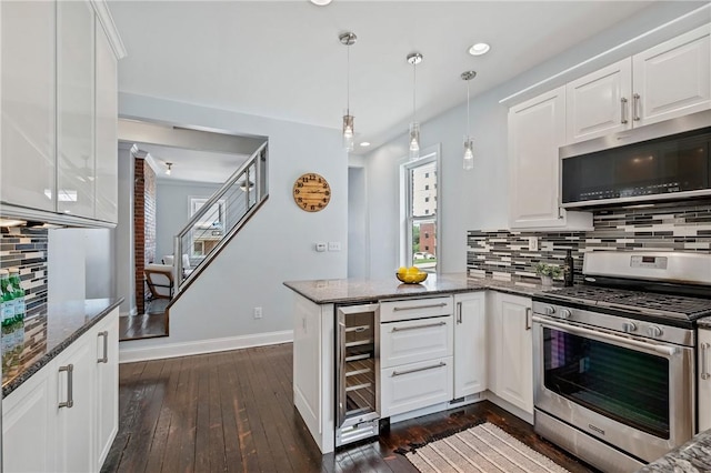 4228 Post St, Lawrenceville, PA 15201 - kitchen with appliances with stainless steel finishes, wine cooler, a peninsula, decorative backsplash, and dark wood finished floors