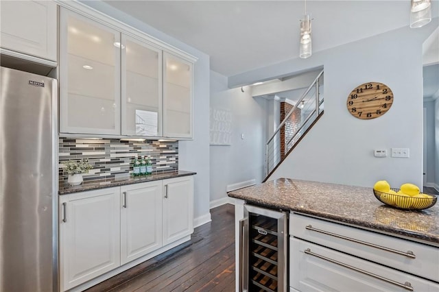 4228 Post St, Lawrenceville, PA 15201 - indoor dry bar with freestanding refrigerator, wine cooler, backsplash, dark wood-style flooring, and stairs