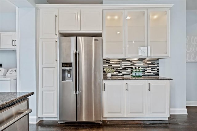 4228 Post St, Lawrenceville, PA 15201 - kitchen with appliances with stainless steel finishes, white cabinetry, dark stone countertops, dark wood-style floors, and glass insert cabinets