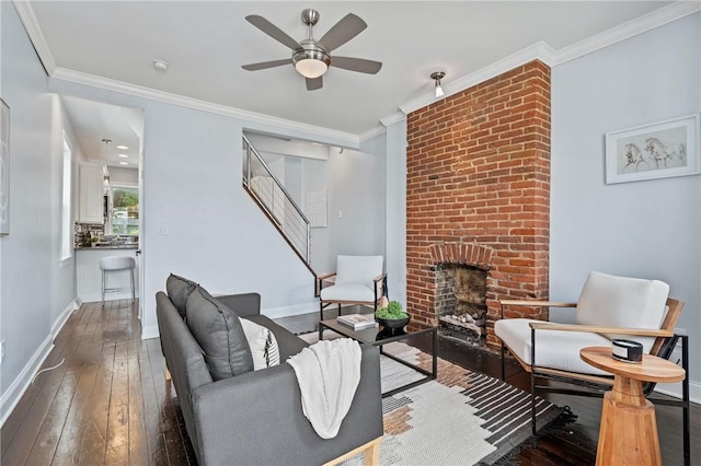 4228 Post St, Lawrenceville, PA 15201 - living room with stairway, wood-type flooring, a ceiling fan, ornamental molding, and a fireplace