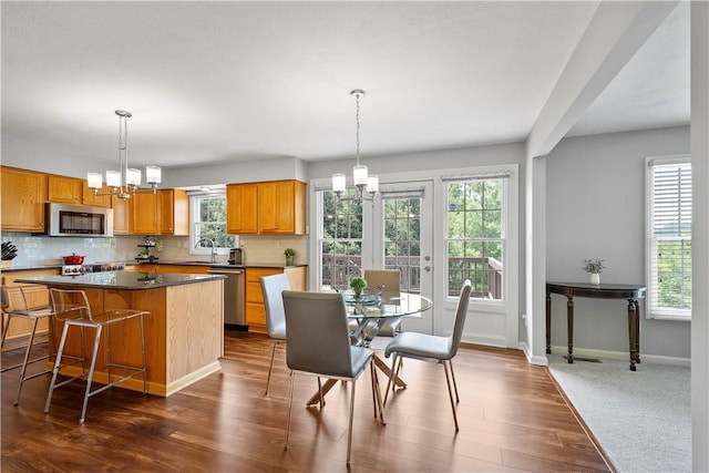 206 Buckeye Ct, Nottingham, PA 15330 - dining space with a chandelier and dark wood finished floors