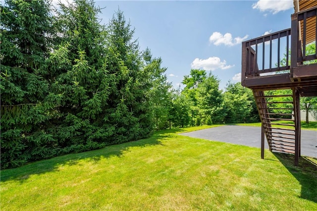 206 Buckeye Ct, Nottingham, PA 15330 - view of green lawn with stairs and a wooden deck