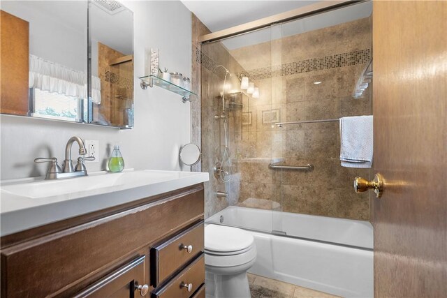 1031 Fiddleback Dr, Kennedy Twp, PA 15136 - bathroom featuring vanity, bath / shower combo with glass door, and tile patterned floors