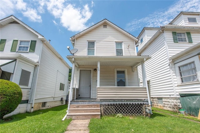 430 Kennedy Ave, East Vandergrift, PA 15629 - view of front of house featuring a porch and a front lawn