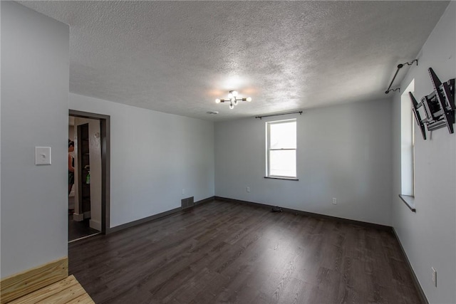 430 Kennedy Ave, East Vandergrift, PA 15629 - empty room with a textured ceiling and dark wood finished floors
