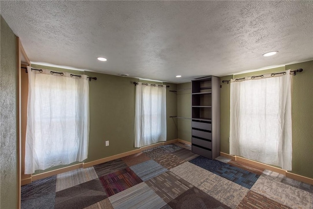430 Kennedy Ave, East Vandergrift, PA 15629 - unfurnished bedroom featuring a textured ceiling, recessed lighting, and carpet