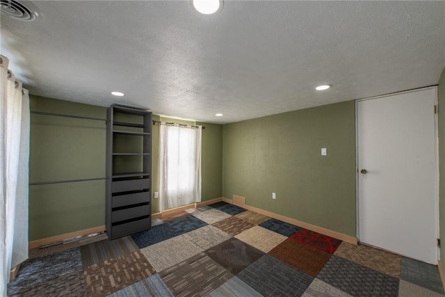 430 Kennedy Ave, East Vandergrift, PA 15629 - unfurnished bedroom with a textured ceiling and recessed lighting