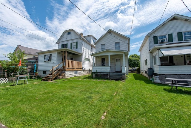 430 Kennedy Ave, East Vandergrift, PA 15629 - back of house with a lawn and a porch