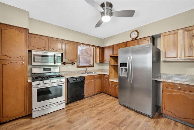 3259 Brodhead Rd, Center Twp, PA 15001 - kitchen with appliances with stainless steel finishes, light countertops, a ceiling fan, brown cabinetry, and light wood finished floors