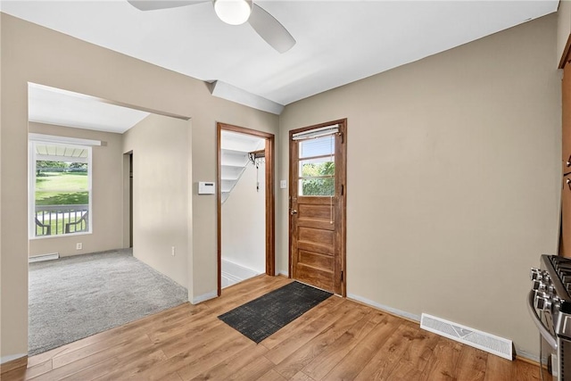 3259 Brodhead Rd, Center Twp, PA 15001 - entrance foyer with light wood-type flooring, ceiling fan, healthy amount of natural light, and a baseboard radiator