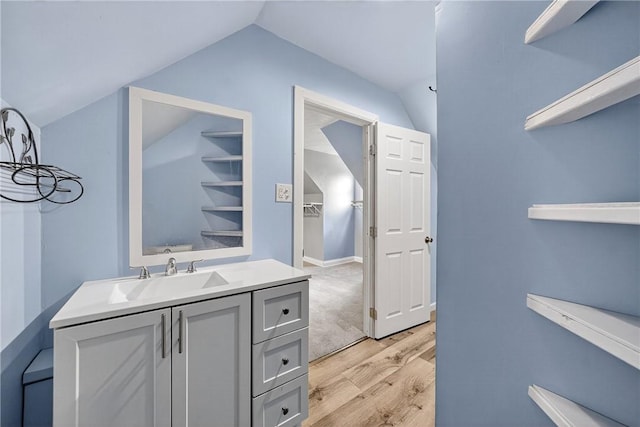 3259 Brodhead Rd, Center Twp, PA 15001 - bathroom featuring lofted ceiling, wood finished floors, and vanity