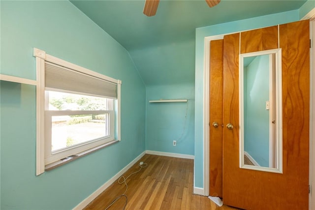 1445 Stanley Dr, Penn Hills, PA 15147 - empty room with vaulted ceiling, wood finished floors, and ceiling fan