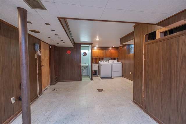 1445 Stanley Dr, Penn Hills, PA 15147 - basement with wood walls, independent washer and dryer, and light flooring