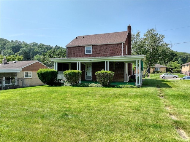 1445 Stanley Dr, Penn Hills, PA 15147 - view of front of house with a front yard, a chimney, and brick siding