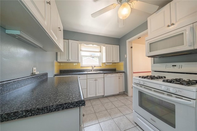 1445 Stanley Dr, Penn Hills, PA 15147 - kitchen featuring white appliances, white cabinets, tasteful backsplash, and dark countertops