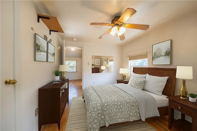 1445 Stanley Dr, Penn Hills, PA 15147 - bedroom with multiple windows, wood finished floors, and ceiling fan