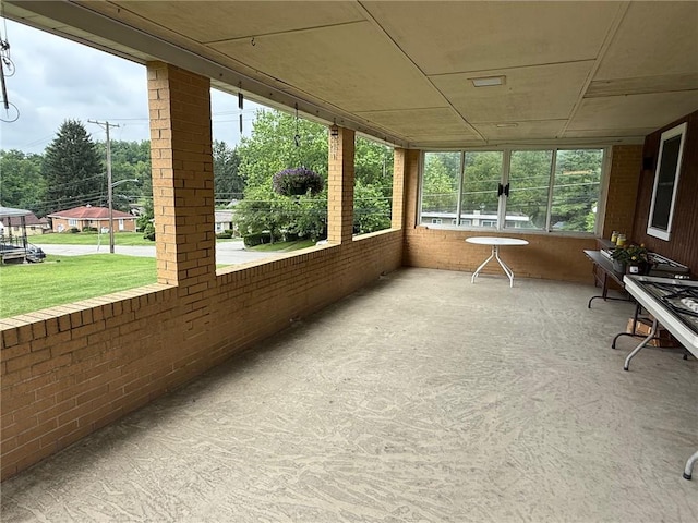 410 Hershey Rd, Penn Hills, PA 15235 - unfurnished sunroom with brick wall and french doors