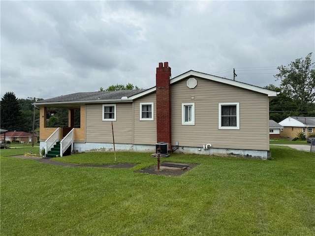 410 Hershey Rd, Penn Hills, PA 15235 - rear view of property featuring a yard and a chimney