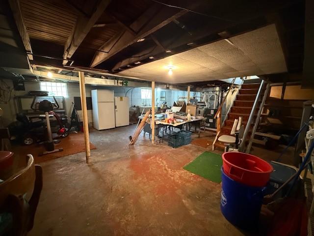 410 Hershey Rd, Penn Hills, PA 15235 - basement featuring freestanding refrigerator and stairs