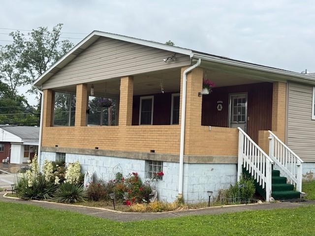 410 Hershey Rd, Penn Hills, PA 15235 - view of side of property featuring brick siding and covered porch