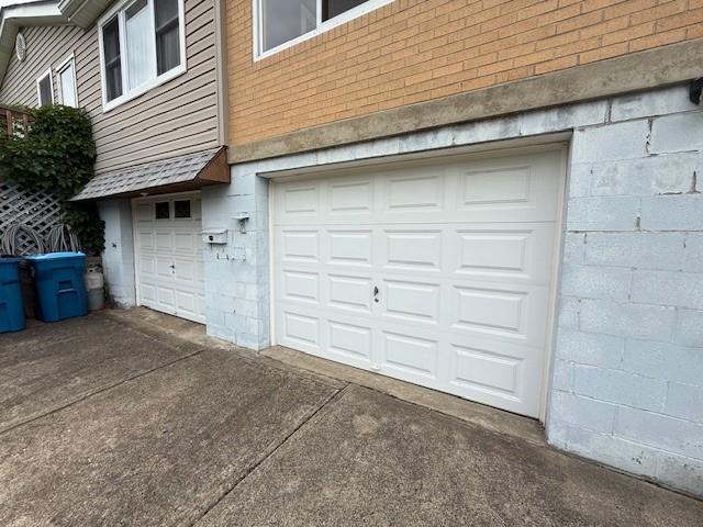410 Hershey Rd, Penn Hills, PA 15235 - garage featuring concrete driveway