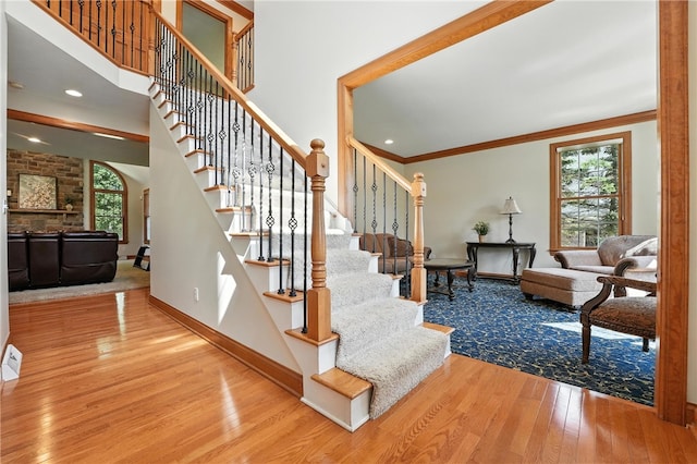 1023 Sophia Ln, Adams Twp, PA 16046 - staircase featuring hardwood / wood-style floors and ornamental molding