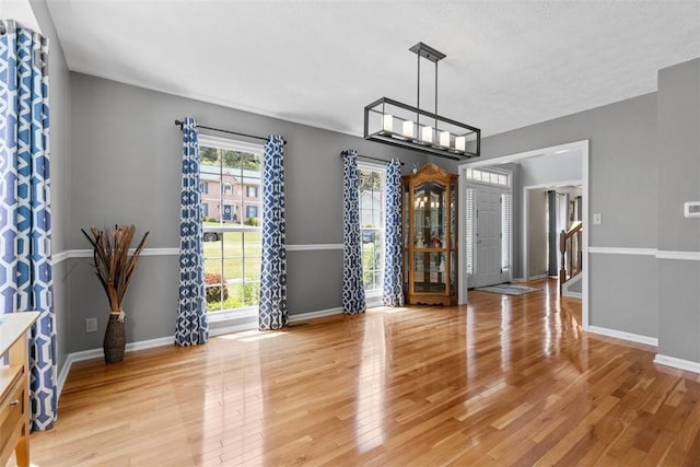 1608 Valley Brooke Ct, Franklin Park, PA 15090 - unfurnished dining area featuring light wood-style flooring and a chandelier