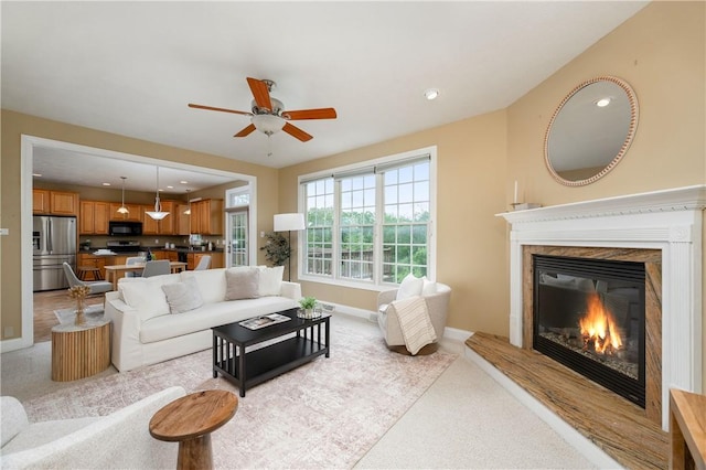 2214 Shannon Mills Dr, Connoquenessing Twp, PA 16053 - living area with light carpet, a glass covered fireplace, ceiling fan, and recessed lighting