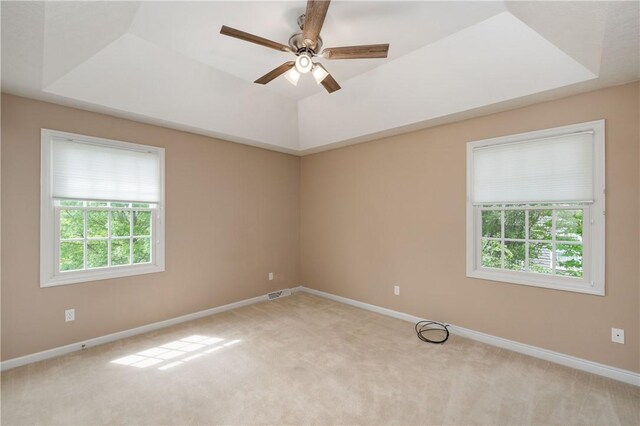2214 Shannon Mills Dr, Connoquenessing Twp, PA 16053 - empty room with plenty of natural light, light colored carpet, and a tray ceiling
